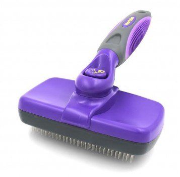 Purple handled slicker brush on white background